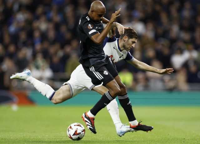 Julio Rodrigues Romao in action with Tottenham Hotspur's Ben Davies