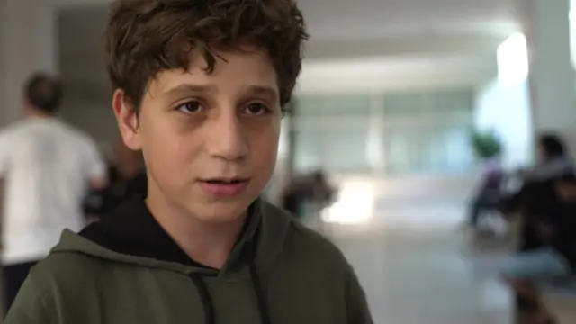 Lebanese boy speaks to reporter