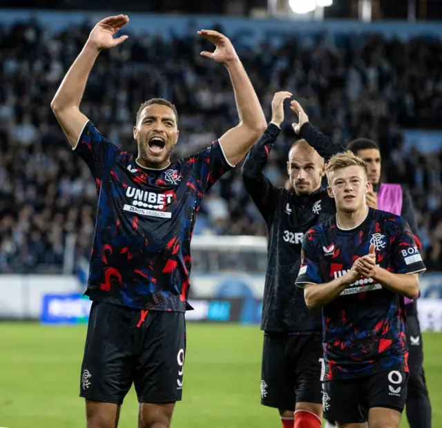 Cyriel Dessers and Connor Barron applaud fans in Malmo