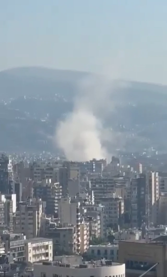 Smoke rises around high-rise buildings in Beirut