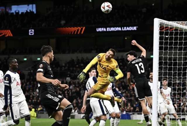 Tottenham Hotspur's Guglielmo Vicario saves the ball