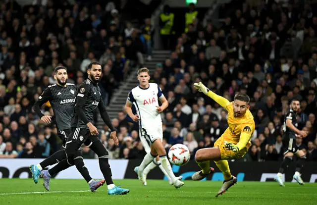 Qarabag FK's Juninho appears as Tottenham Hotspur's Guglielmo Vicario looks on