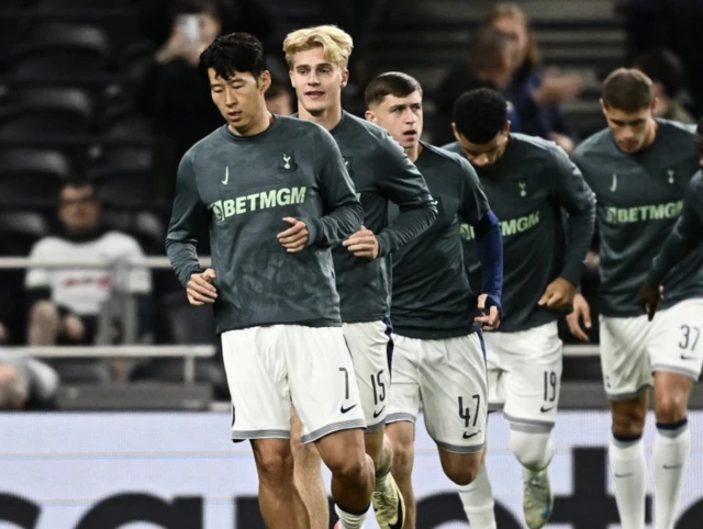 Tottenham Hotspur's Son Heung-min, Lucas Bergvall and Mikey Moore during the warm up