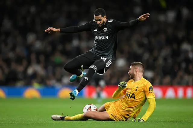 Juninho of Qarabag FK is challenged by Guglielmo Vicario