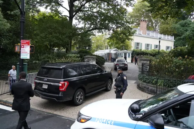 Police pictured outside the home of New York City Mayor Eric Adams