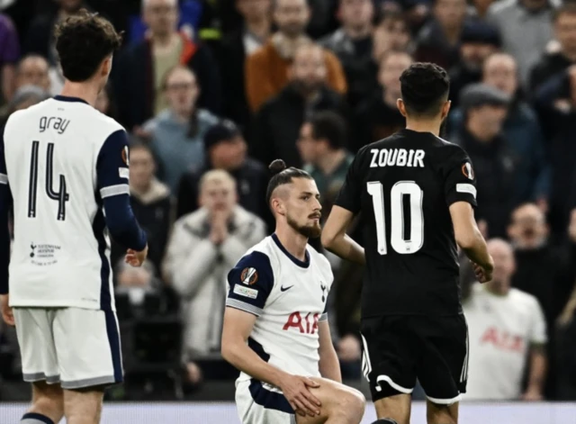 Tottenham Hotspur's Radu Dragusin reacts after is shown a red card