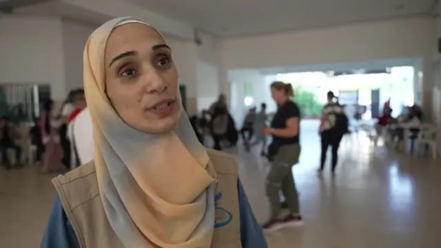 Woman speaks to reporters