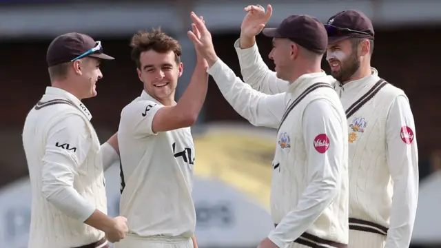 Surrey celebrate taking wicket