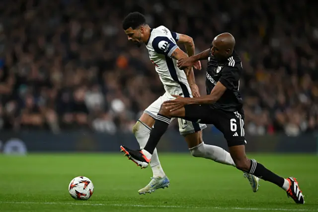 Tottenham Hotspur's Dominic Solanke is challenged by Julio Romao