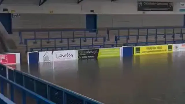 AFC Telford United's stadium with flood water on the pitch