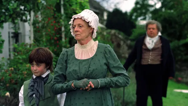 MAGGIE SMITH as Betsey Trotwood and DANIEL RADCLIFFE as David Copperfield