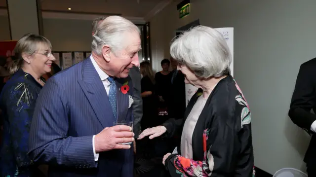 King Charles speaking to Maggie Smith in 2016