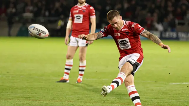 Marc Sneyd kicks Salford ahead v Leigh