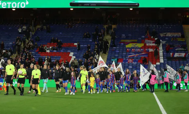 Players make their way out onto the pitch