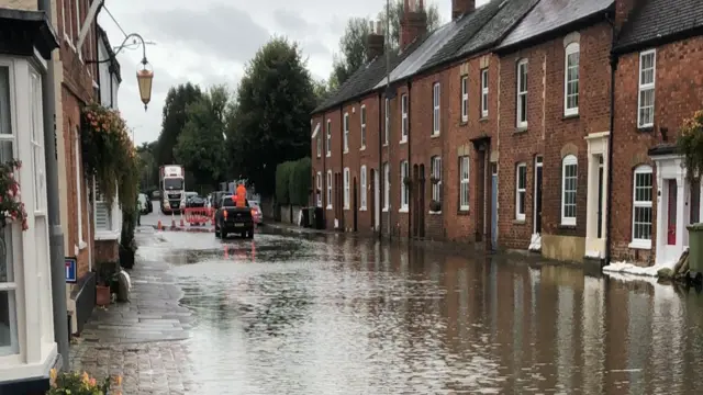 Flooded high street in the market town of Stony Stratford, Bucks