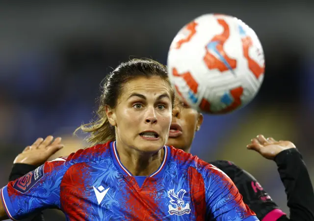 Stengel's eyes are fixed on the ball as she looks to break free