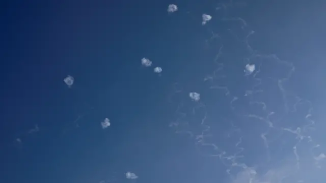 Smoke trails and rings in the sky