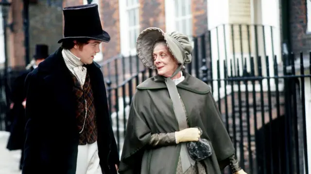 Maggie Smith in costume alongside Ciaran McMenamin as David Copperfield