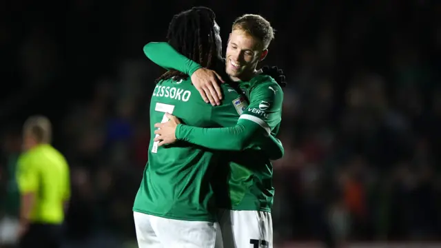 Plymouth's Lewis Gibson hugs goalscorer Ibrahim Cissoko