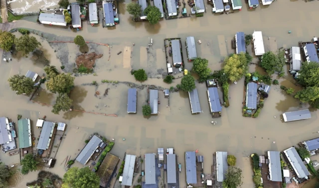 A drone shot shows a flooded caravan site in Cogenhoe