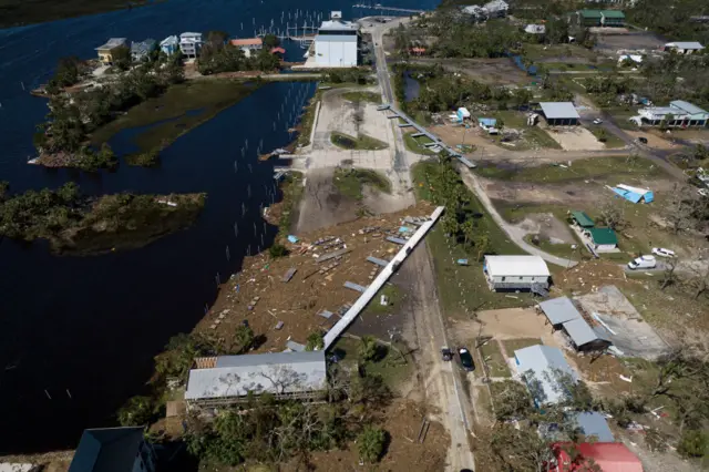 This aerial picture taken on September 27, 2024 shows a floating dock washed up by storm surge lying on a street after Hurricane Helene made landfall in Steinhatchee, Florida.