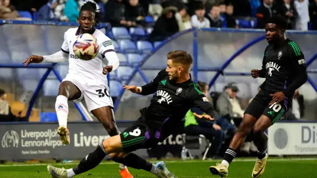 Tranmere Rovers' Omari Patrick takes on Salford City's Luke Garbutt