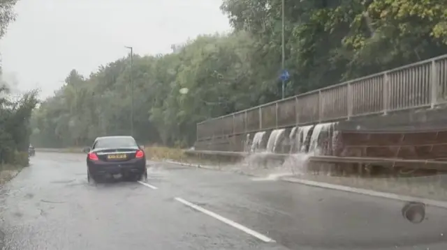 Car driving through floods