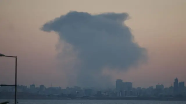 Large smoke plume rises over Beirut after an explosion