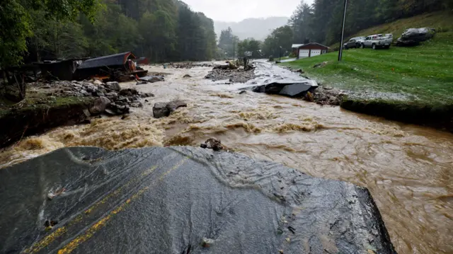 The Laurel Fork Road bridge sits destroyed from flood waters raging in the Upper Laurel Fork creek after Tropical Storm Helene struck, in Vilas, North Carolina,