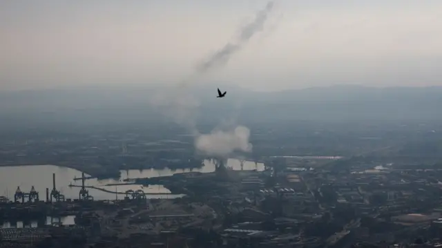 Landscape shot with smoke rising