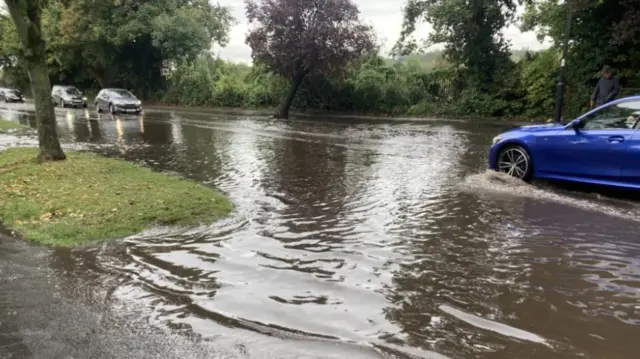 Cars driving through water on Radford Road in Leamington