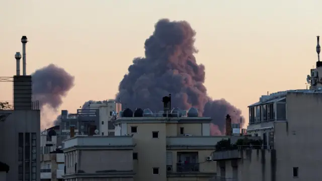 Large smoke plume rises over Beirut after an explosion