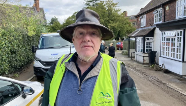 Andy Munro in a hat and high visibility jacket