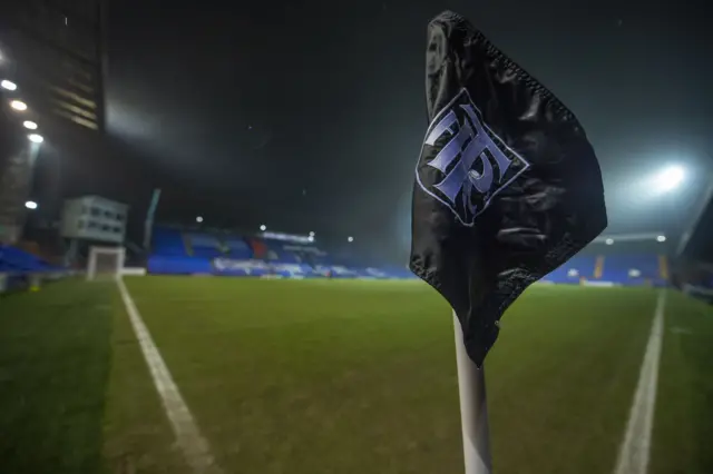 A floodlit Prenton Park at night