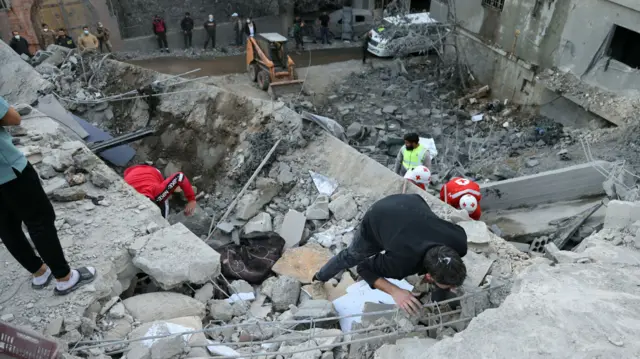 People inspect the destruction following an overnight Israeli airstrike in the southern Lebanese village of Shebaa near the border between the two countries