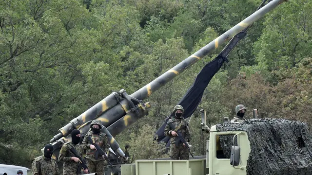 Hezbollah fighters displaying some of their weapons arsenal to the media last year