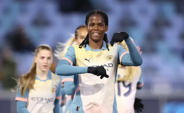 Khadija Shaw celebrates after scoring against Paris FC