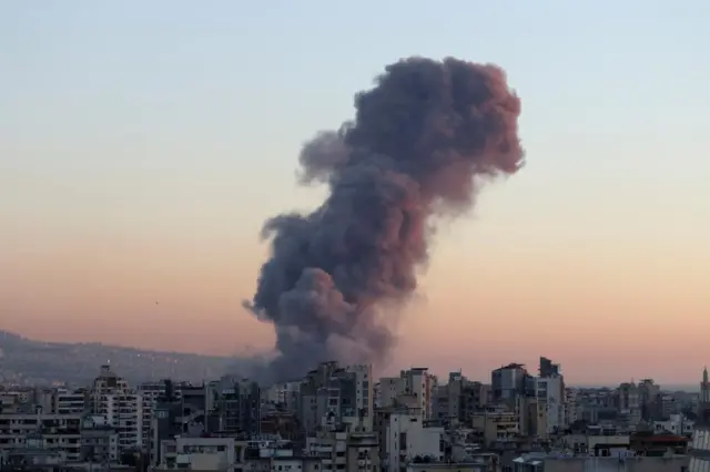 Large smoke plume rises over Beirut after an explosion