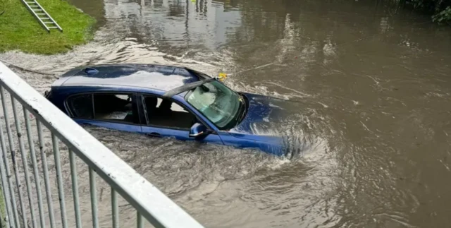 A partially submerged car