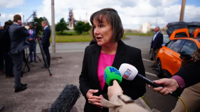 Welsh Secretary Jo Stevens talking to the media during the general election campaign with the Port Talbot steelworks in the background