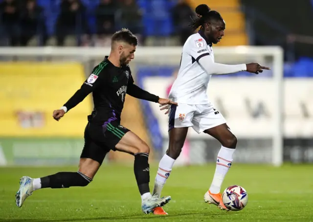 Salford City's Luke Garbutt and Tranmere Rovers' Omari Patrick battle for the ball