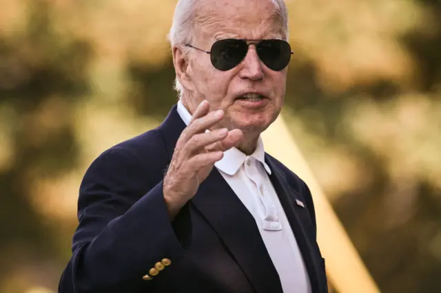 US President Joe Biden responds to questions shouted by members of the press pool as he walks into St. Edmond's Catholic Church in Rehoboth Beach, Delaware on September 28, 2024