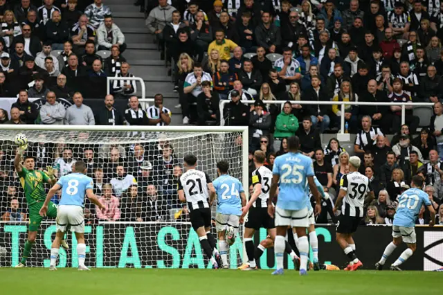 Nick Pope (L) makes a save