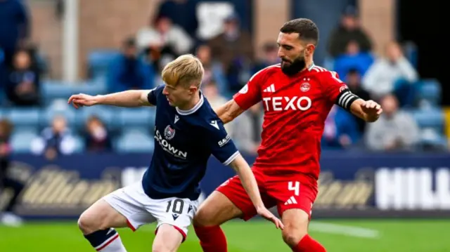 DUNDEE, SCOTLAND - SEPTEMBER 28: Dundee's Lyall Cameron and Aberdeen's Graeme Shinnie in action during a William Hill Scottish Premiersihp match between Dundee FC and Aberdeen at the Scot Foam Stadium at Dens Park, on September 28, 2024, in Dundee, Scotland. (Photo by Rob Casey / SNS Group)