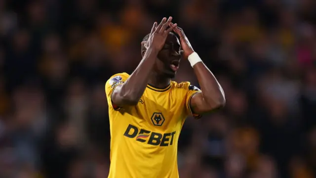 Carlos Forbs of Wolverhampton Wanderers rues a missed chance during the Premier League match between Wolverhampton Wanderers FC and Liverpool FC at Molineux on September 28, 2024 in Wolverhampton, England.