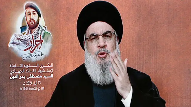 Hezbollah leader Hassan Nasrallah delivers a speech via a screen during a rally outside Beirut, Lebanon, 13 May 2024 (