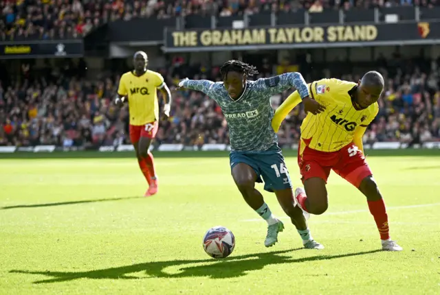 Romaine Mundle of Sunderland in action against Edo Kayembe of Watford