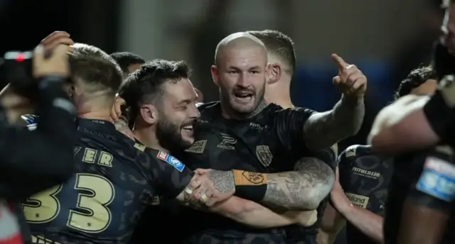 Leigh players celebrate a try against Salford