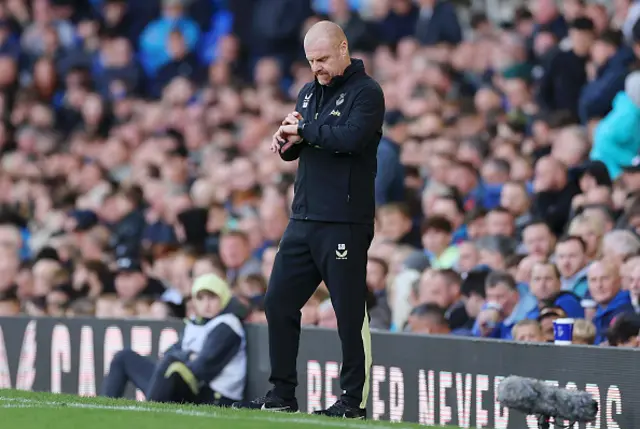 Sean Dyche, Manager of Everton, checks his watch