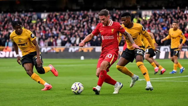 Alexis Mac Allister of Liverpool during the Premier League match between Wolverhampton Wanderers FC and Liverpool FC at Molineux on September 28, 2024 in Wolverhampton, England.